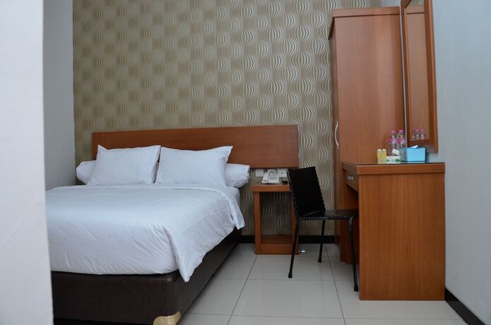 Imagen de la habitación del Hotel Sunrise Semarang. Foto 25