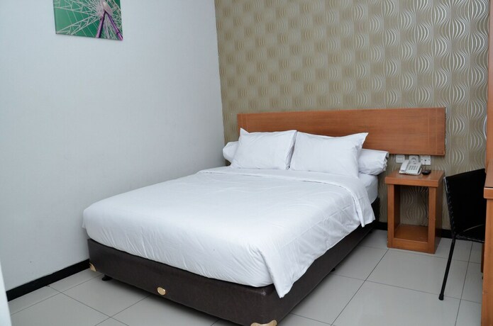 Imagen de la habitación del Hotel Sunrise Semarang. Foto 26