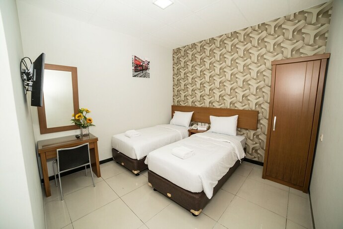 Imagen de la habitación del Hotel Sunrise Semarang. Foto 28