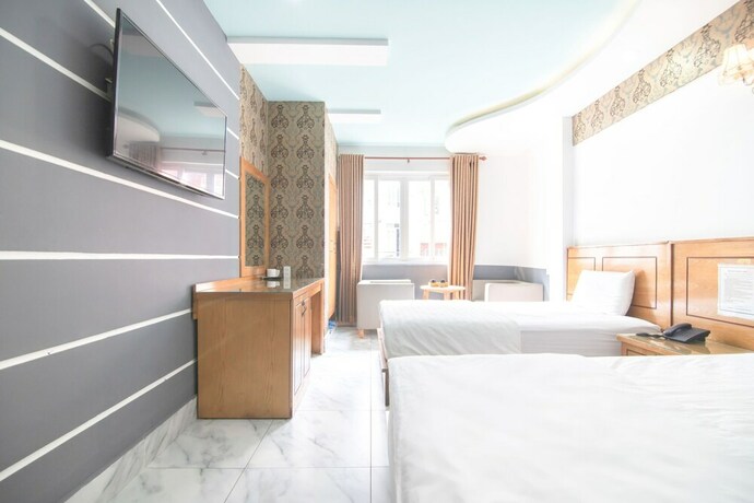 Imagen de la habitación del Hotel Sunrise Trung Son. Foto 23
