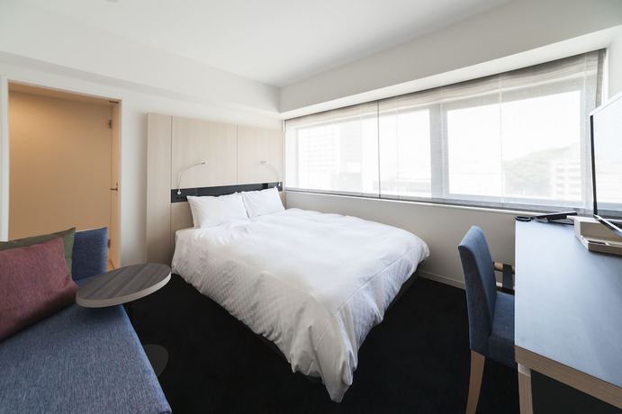 Imagen de la habitación del Hotel Sunroute Tokushima. Foto 3