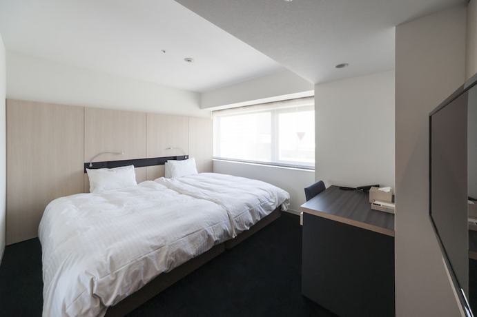 Imagen de la habitación del Hotel Sunroute Tokushima. Foto 17