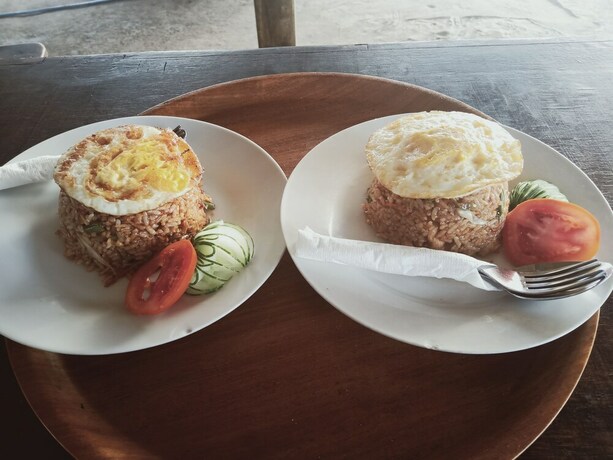 Imagen del bar/restaurante del Hotel Sunset Beach Bungalow and Restaurant. Foto 6