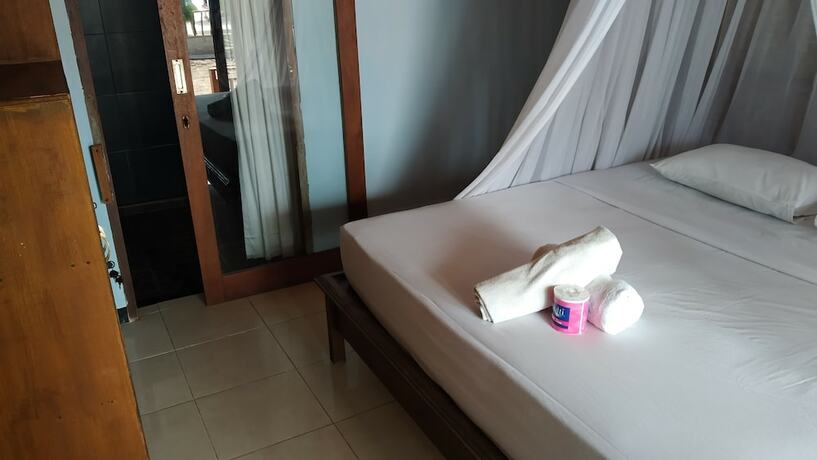 Imagen de la habitación del Hotel Sunset Beach Bungalow and Restaurant. Foto 13