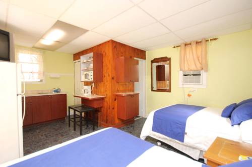 Imagen de la habitación del Hotel Sunset Cove Beach Resort. Foto 6