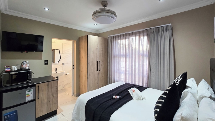 Imagen de la habitación del Hotel Sunset Events and Accommodation. Foto 8