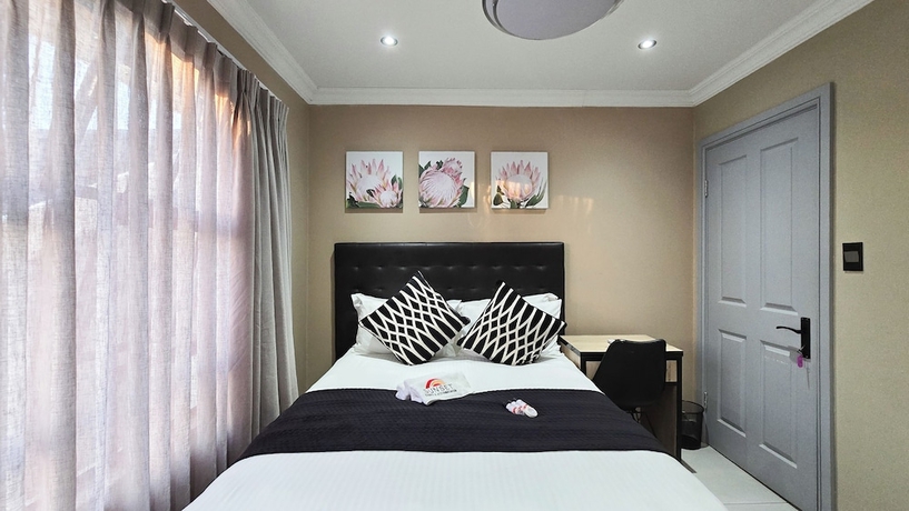 Imagen de la habitación del Hotel Sunset Events and Accommodation. Foto 9