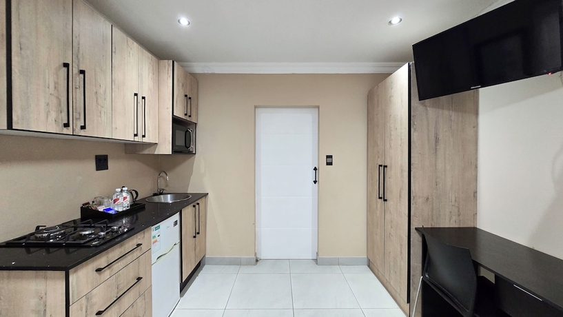 Imagen de la habitación del Hotel Sunset Events and Accommodation. Foto 11