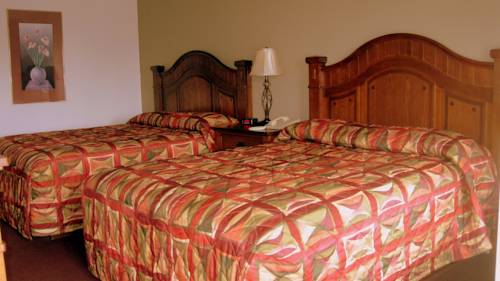 Imagen de la habitación del Hotel Sunset Inn And Suites. Foto 4