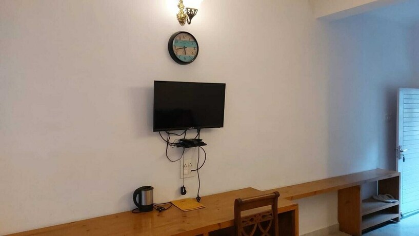 Imagen de la habitación del Hotel Sunshine Dharamshala. Foto 18