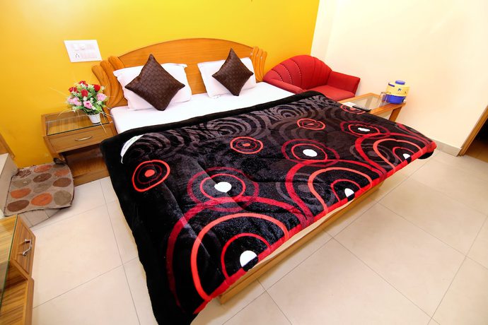 Imagen de la habitación del Hotel Sunshine, Haridwar. Foto 17