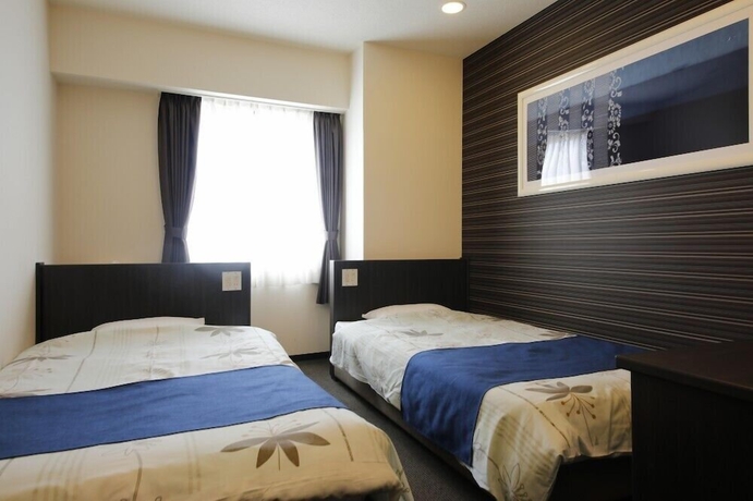 Imagen de la habitación del Hotel Sunshine Tokushima. Foto 9