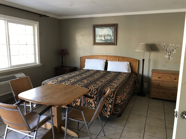 Imagen de la habitación del Hotel Sunshine Village Motel. Foto 6