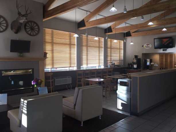 Imagen del bar/restaurante del Hotel Super 8 By Wyndham Helena. Foto 2