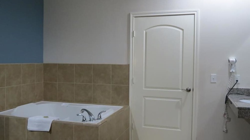 Imagen de la habitación del Hotel Super 8 By Wyndham Houston North I-45. Foto 11