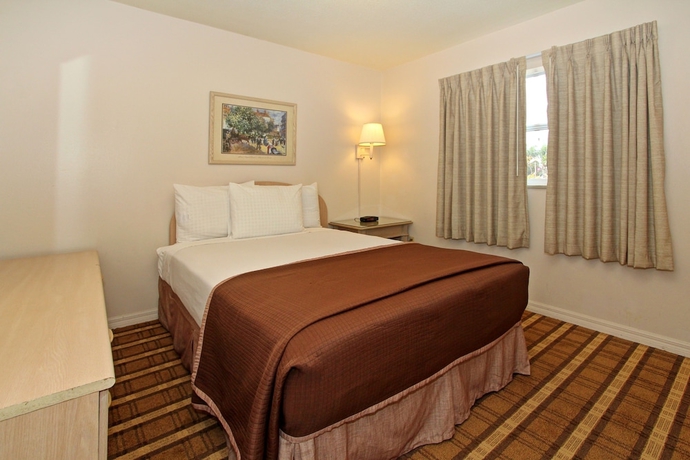 Imagen de la habitación del Hotel Super 8 By Wyndham Kissimmee. Foto 12