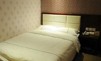 Imagen de la habitación del Hotel Super 8 Tengzhou Railway Station. Foto 7