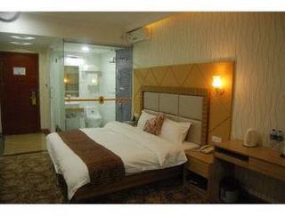 Imagen de la habitación del Hotel Super 8 by Wyndham Huizhou Bus Terminal. Foto 2