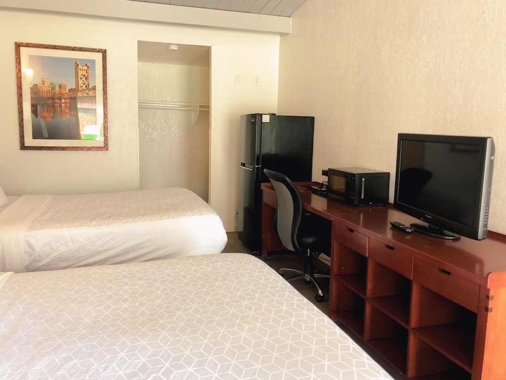 Imagen de la habitación del Hotel Super 8 by Wyndham San Jose Airport. Foto 11