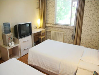 Imagen de la habitación del Hotel Super 8 by Wyndham Tiajin Chang Jiang Dao. Foto 4