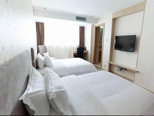 Imagen de la habitación del Hotel Super 8 by Wyndham Xiamen Railway Station. Foto 2
