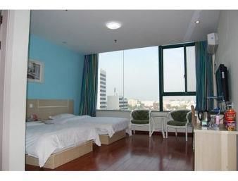 Imagen de la habitación del Hotel Super 8 by Wyndham Yizheng Shi Dai Guang Chang. Foto 3