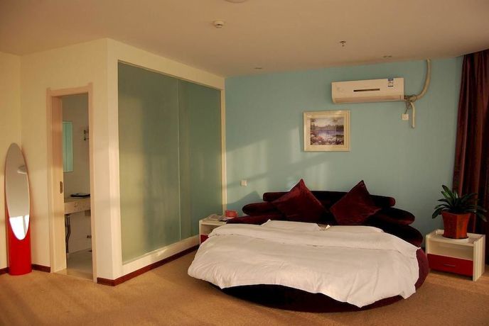 Imagen de la habitación del Hotel Super 8 by Wyndham Yizheng Shi Dai Guang Chang. Foto 4