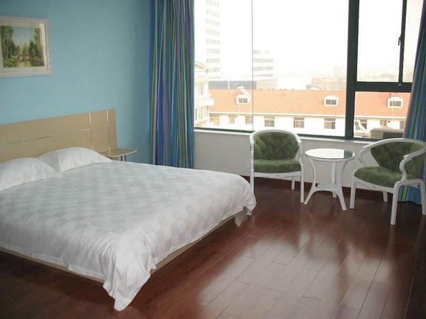 Imagen de la habitación del Hotel Super 8 by Wyndham Yizheng Shi Dai Guang Chang. Foto 5