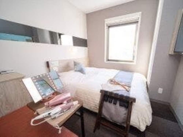 Imagen de la habitación del Hotel Super Beppu Ekimae. Foto 13