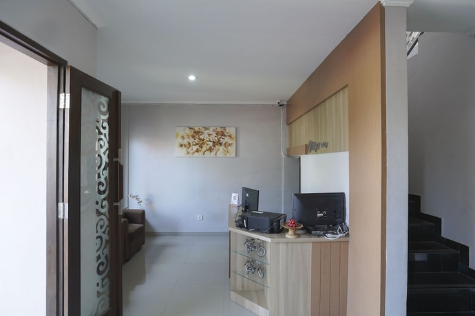 Imagen de los interiores del Hotel Super Capital O 2166 Elitya Stay. Foto 12
