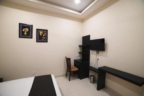 Imagen de la habitación del Hotel Super Collection O Ovel Hotel Grand. Foto 17
