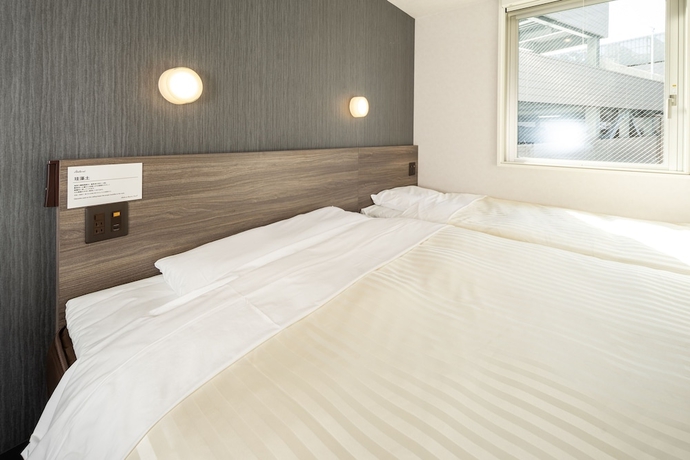 Imagen de la habitación del Hotel Super Hiroshima Natural Hot Springs Yagenboridori. Foto 12