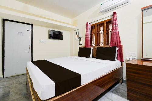 Imagen de la habitación del Hotel Super Hotel O Khandagiri Near DN Regalia Mall. Foto 13