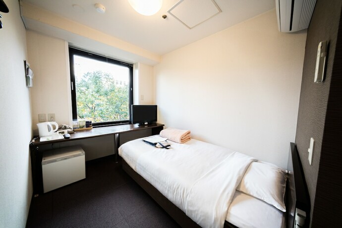 Imagen de la habitación del Hotel Super Inn Sendai Kokubuncho. Foto 10