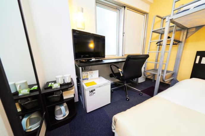 Imagen de la habitación del Hotel Super Jr Shin-osaka Higashiguchi. Foto 12