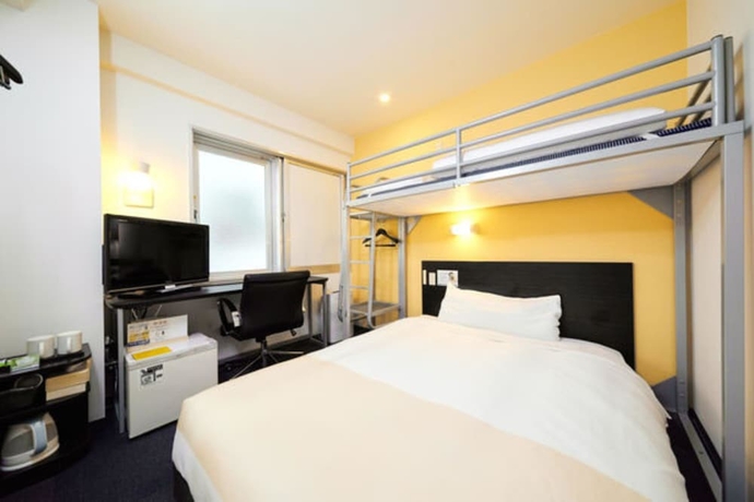 Imagen de la habitación del Hotel Super Jr Shin-osaka Higashiguchi. Foto 13