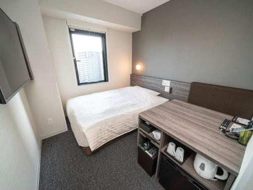 Imagen de la habitación del Hotel Super Kumamoto Ekimae Natural Hot Springs. Foto 15