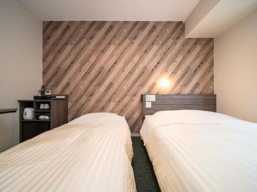 Imagen de la habitación del Hotel Super Kumamoto Ekimae Natural Hot Springs. Foto 18