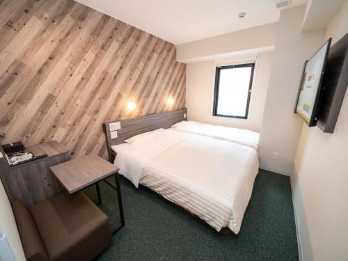 Imagen de la habitación del Hotel Super Kumamoto Ekimae Natural Hot Springs. Foto 19