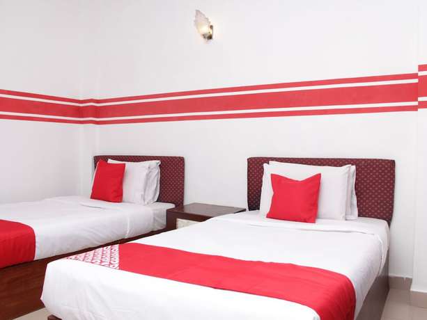 Imagen de la habitación del Hotel Super OYO 1173 Mandyrin. Foto 6