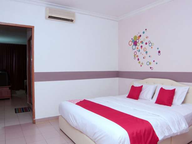 Imagen de la habitación del Hotel Super OYO 1173 Mandyrin. Foto 7