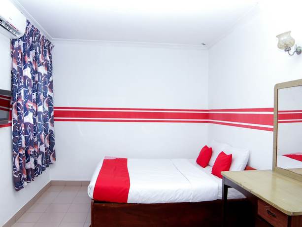 Imagen de la habitación del Hotel Super OYO 1173 Mandyrin. Foto 9