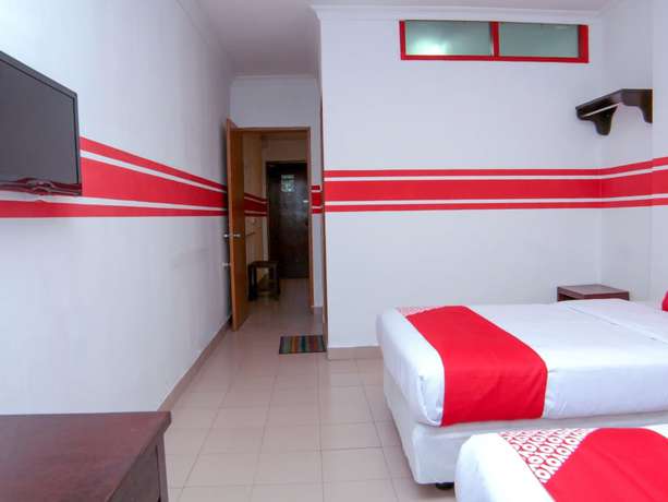 Imagen de la habitación del Hotel Super OYO 1173 Mandyrin. Foto 13