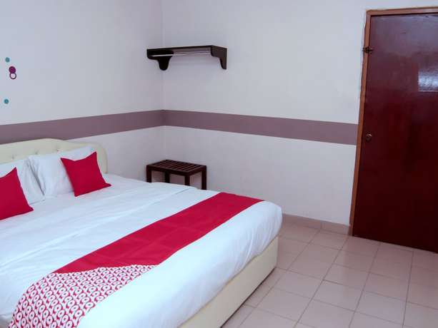 Imagen de la habitación del Hotel Super OYO 1173 Mandyrin. Foto 14