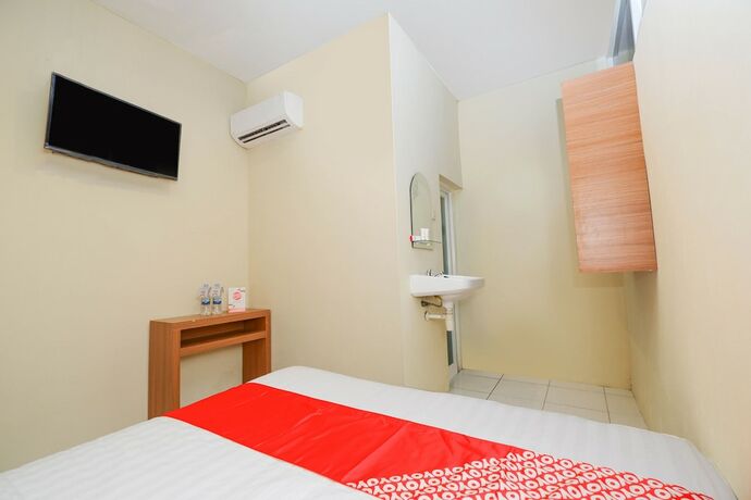 Imagen de la habitación del Hotel Super OYO 1250 Unta Residence. Foto 17