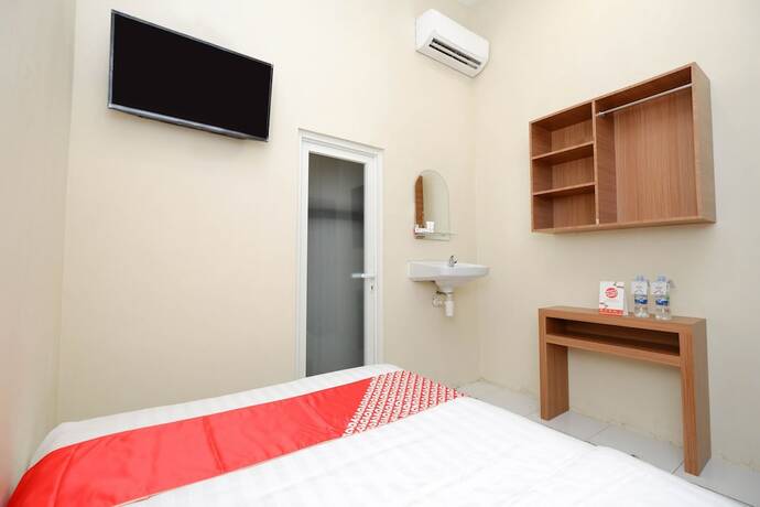 Imagen de la habitación del Hotel Super OYO 1250 Unta Residence. Foto 18