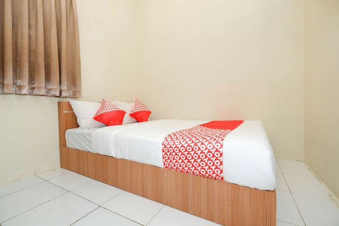 Imagen de la habitación del Hotel Super OYO 1250 Unta Residence. Foto 19