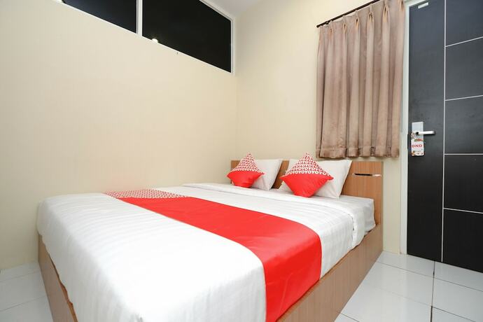 Imagen de la habitación del Hotel Super OYO 1250 Unta Residence. Foto 20