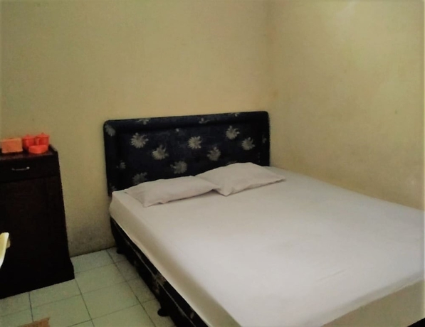 Imagen de la habitación del Hotel Super OYO 1340 Wisma Alamanda. Foto 4