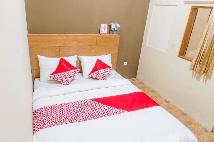 Imagen de la habitación del Hotel Super OYO 1340 Wisma Alamanda. Foto 8